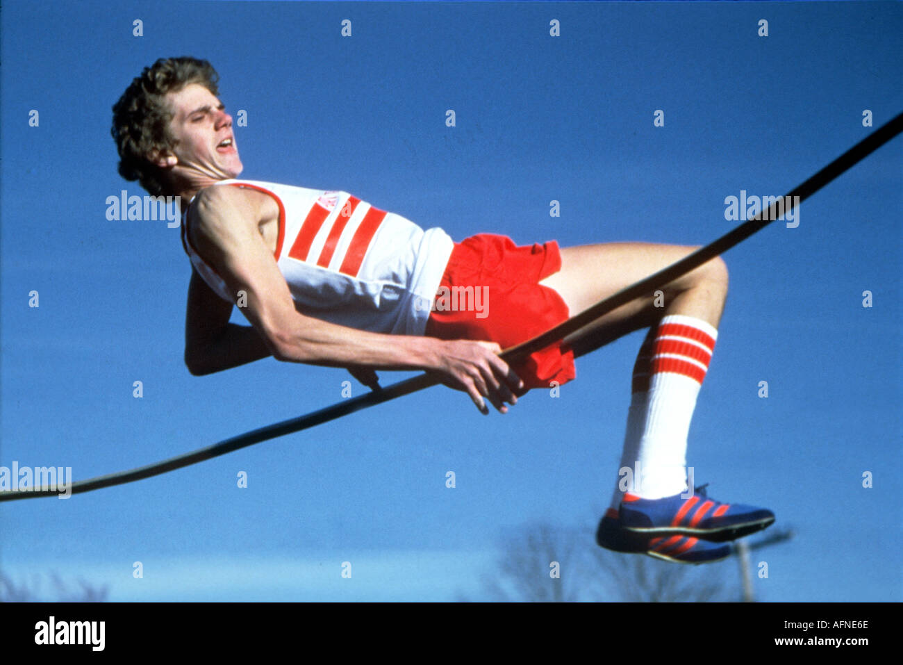 High school male participate in the high jump event Stock Photo Alamy
