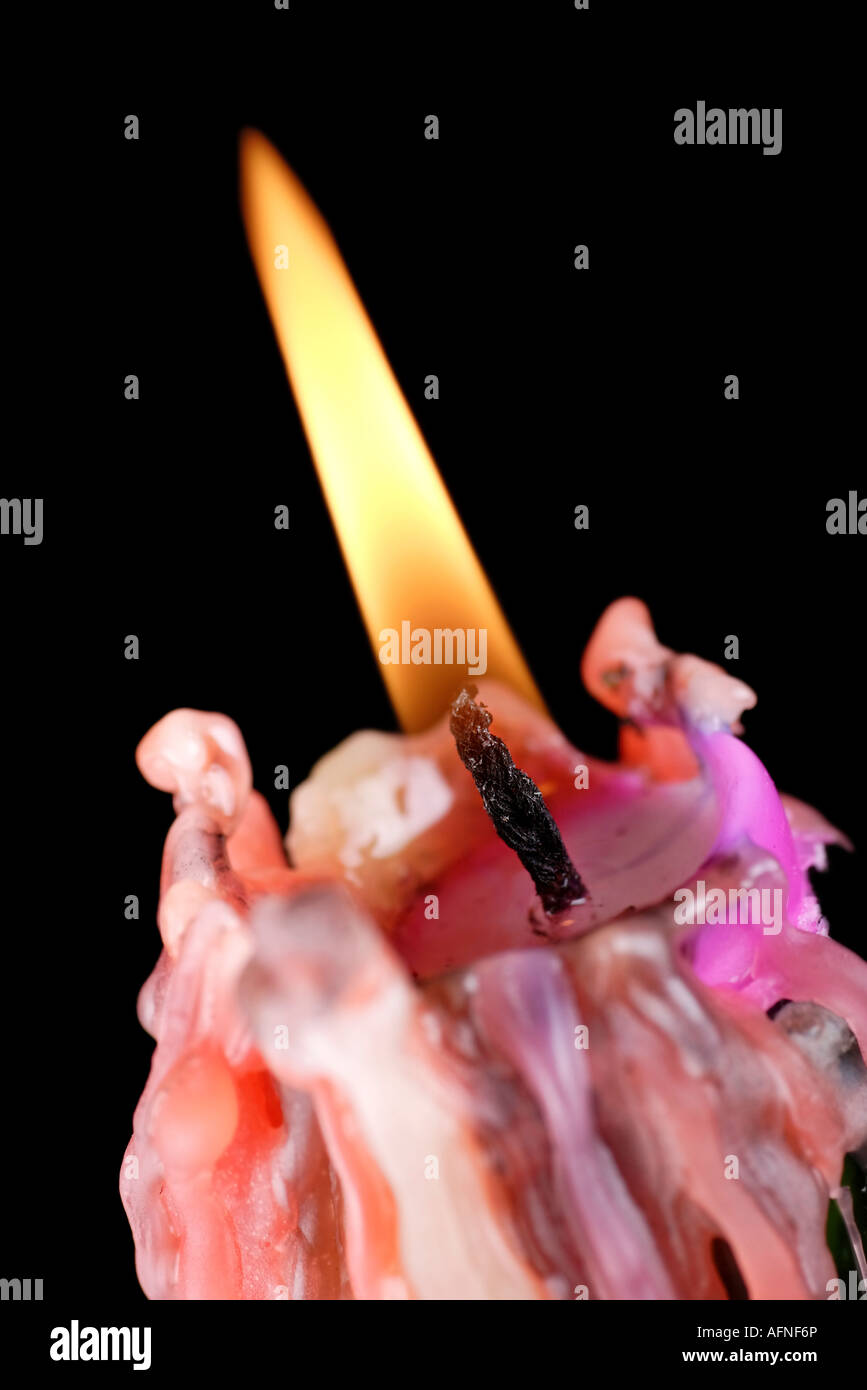 melting old wax candle and flame Stock Photo Alamy