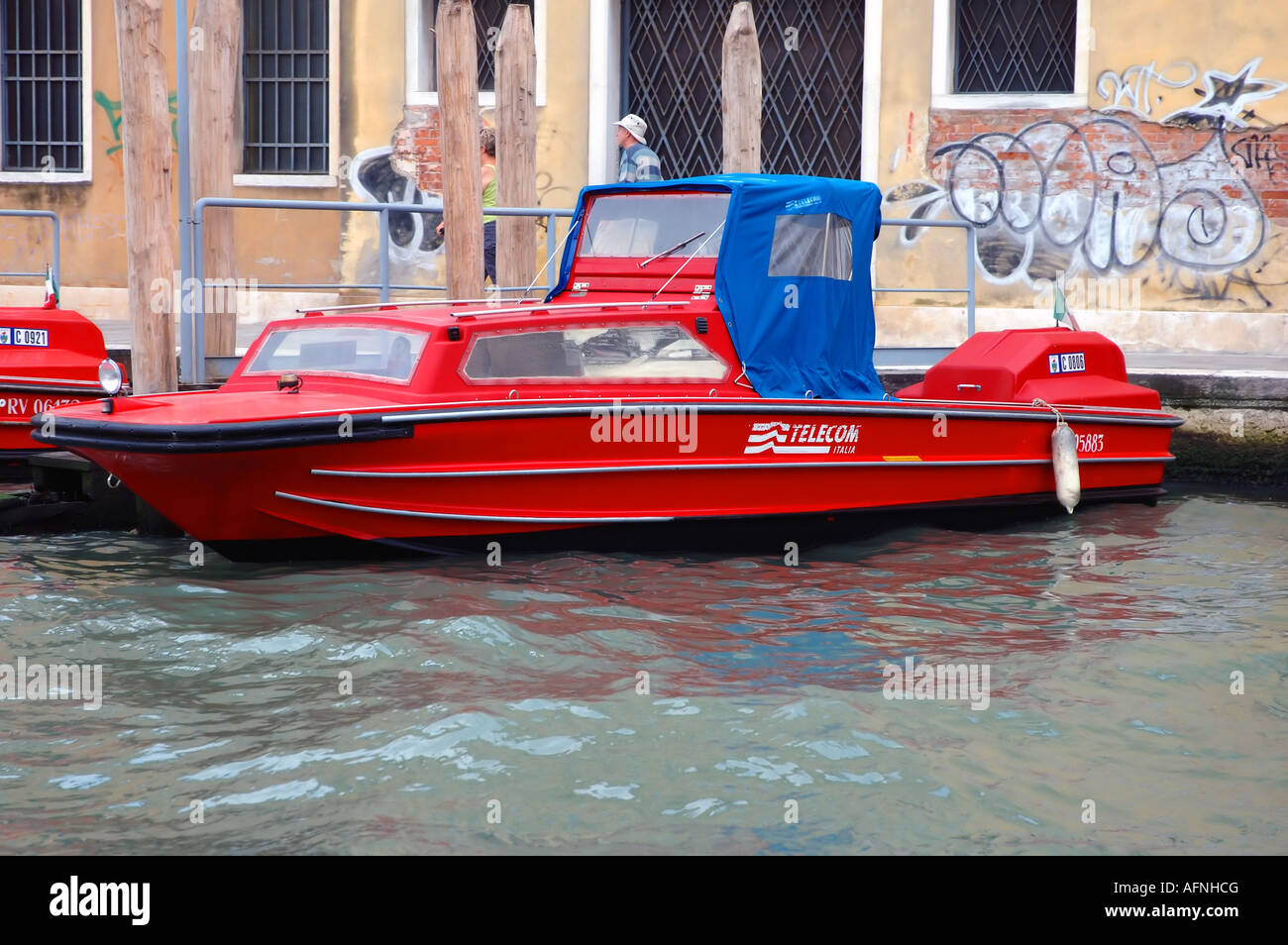 Telecom Italia maintenance boat on the canals of Venice Italy No PR Stock Photo