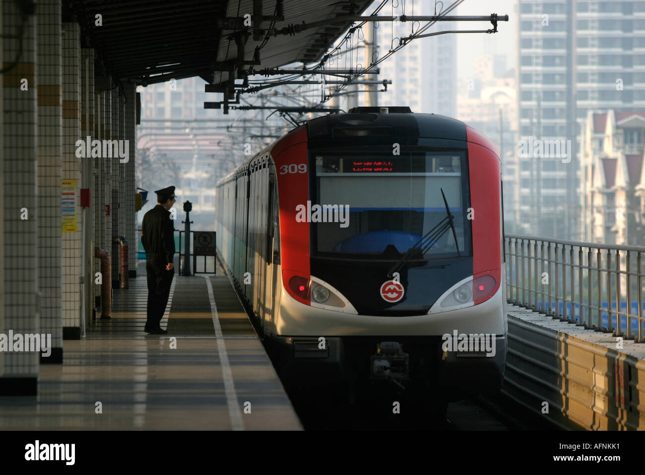Shanghai, China. A train from Shanghai's light rail system pulls in to Cao Yang Road station. Stock Photo