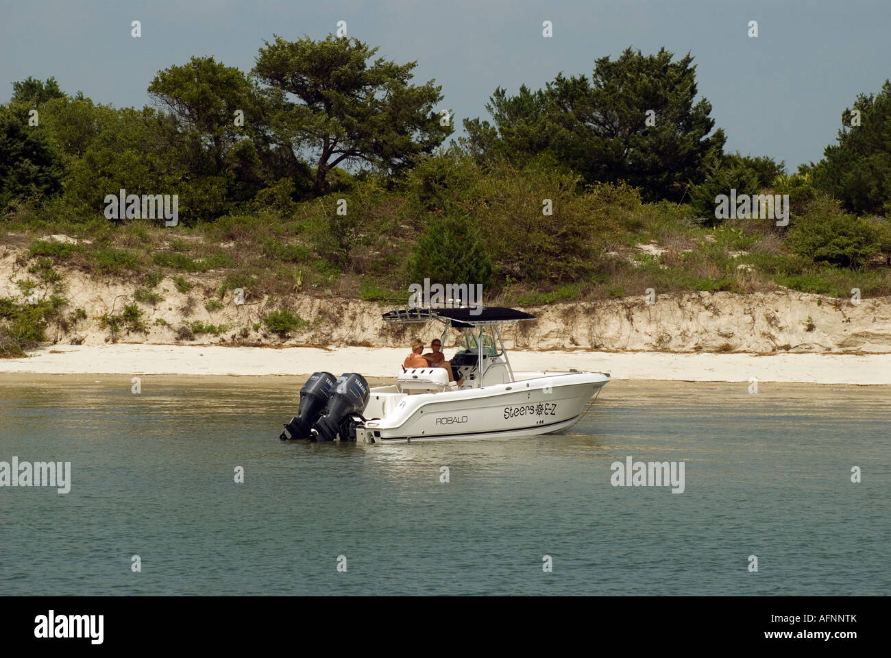 boating couple takes a break along Salt Run in Matanzas Bay St Augustine Florida Stock Photo