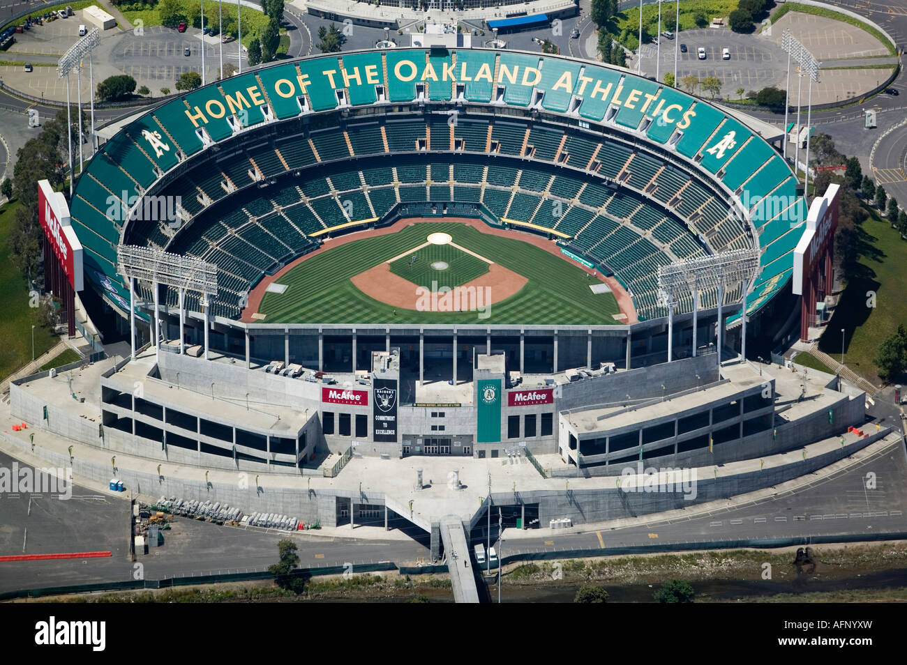 A few members of the Oakland Athletics baseball team train in a virtually empty McAfee Oakland Coliseum Stock Photo