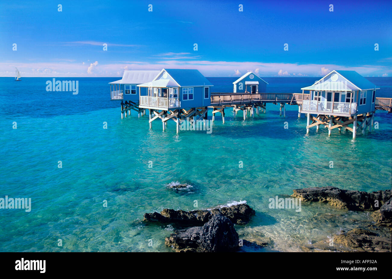 Bermuda Caribbean Resort guest cabins on ocean blue waters of the Caribbean Ocean Stock Photo