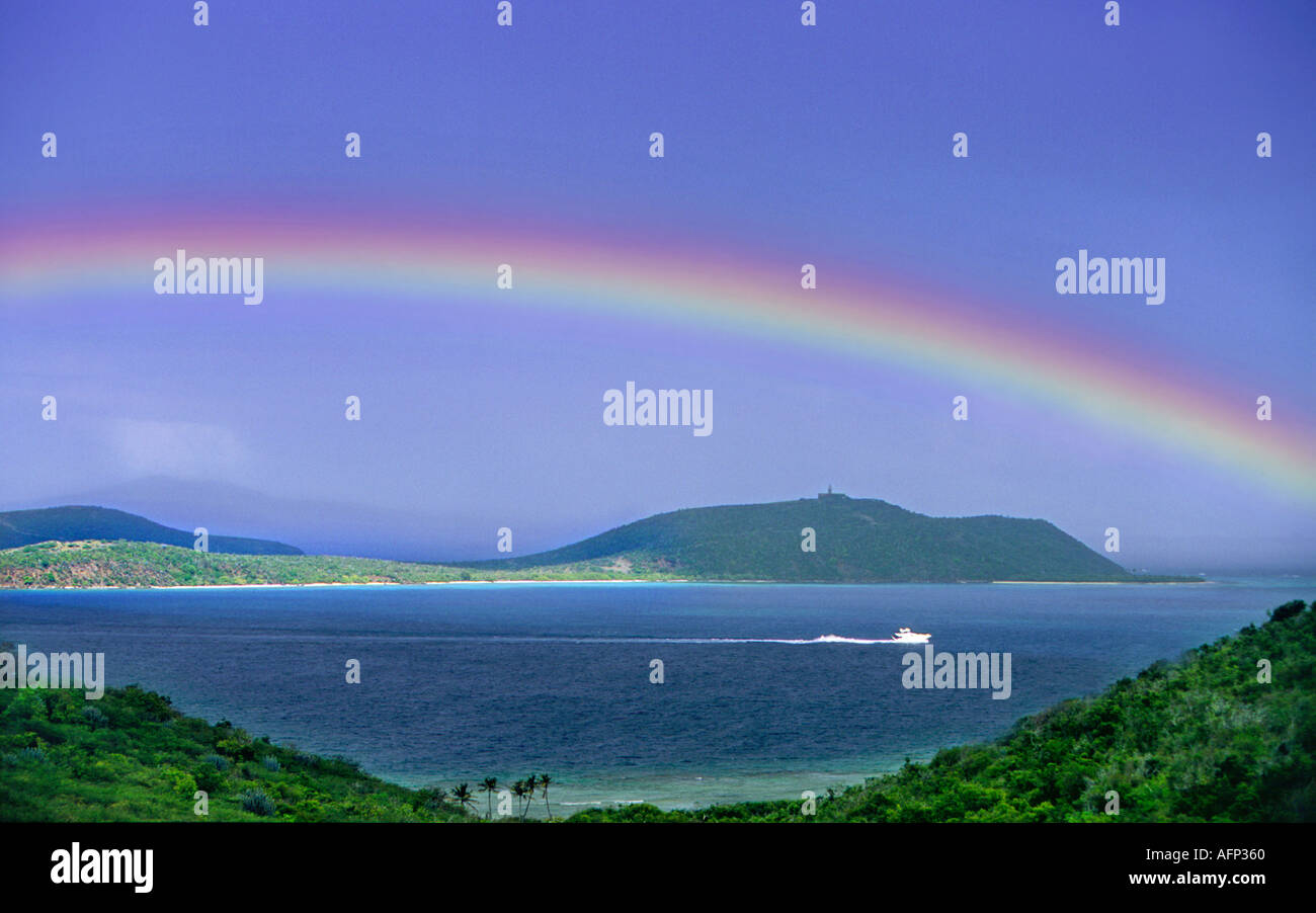 USA Puerto Rico Caribbean Island of Culebra boat  navigating under colorful Rainbow Stock Photo