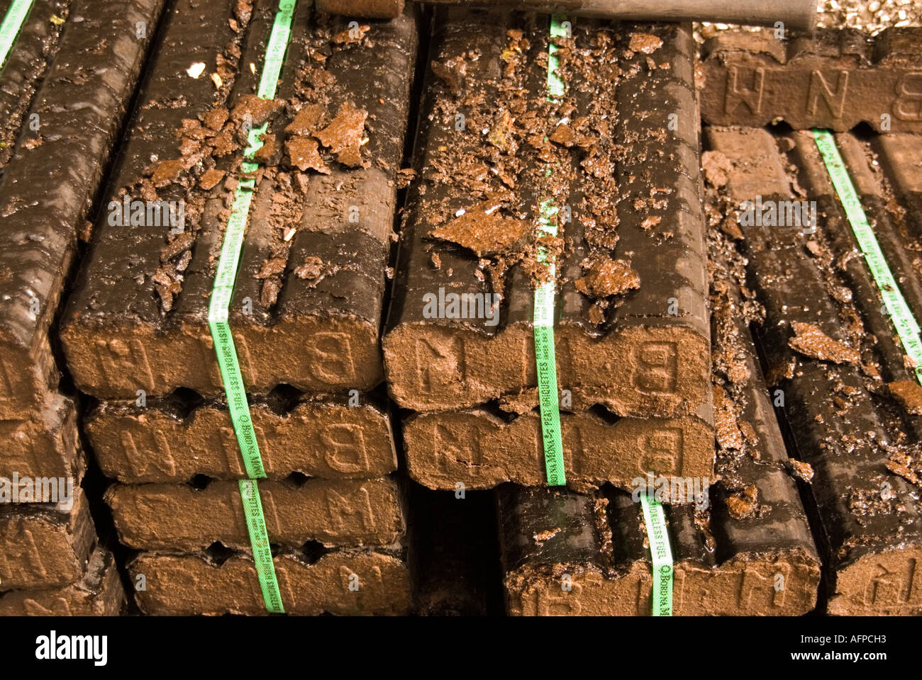 Piled up peat blocks ready for the fire in Broughshane County Antrim Stock Photo