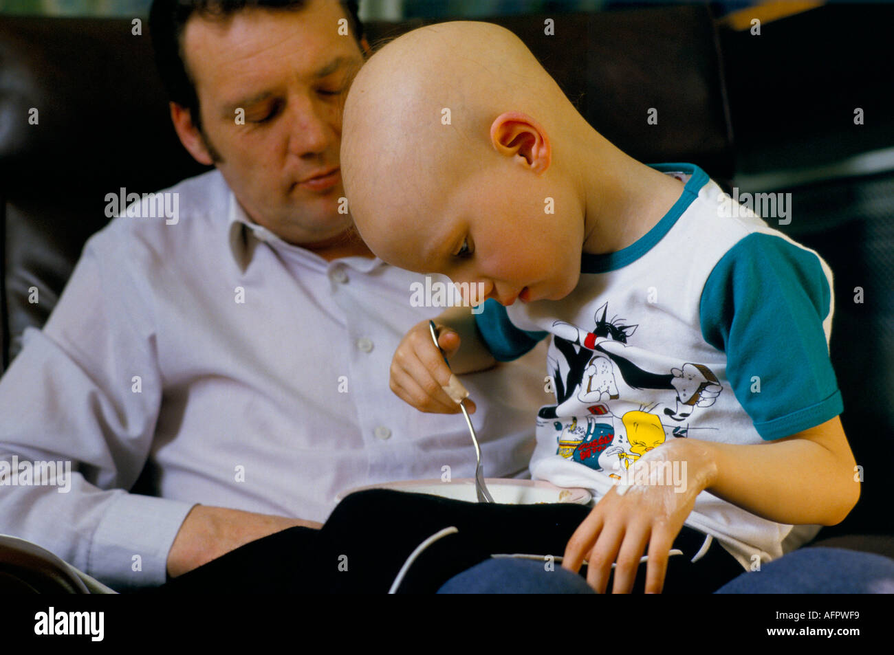 NHS children ward 1980s Child cancer patient with his father who is looking after his son. Alder Hey Children's Hospital Liverpool 1988 UK HOMER SYKES Stock Photo