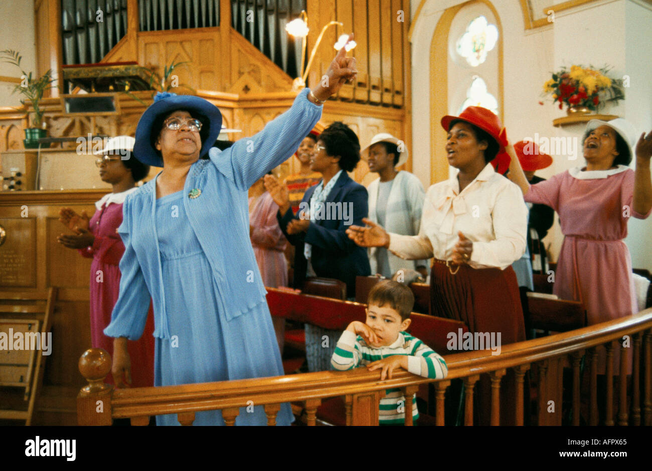 Praise The Lord is cried out Pentecostal church service in Brixton 1990s UK multiethnic Sunday worship south London 90s England HOMER SYKES Stock Photo