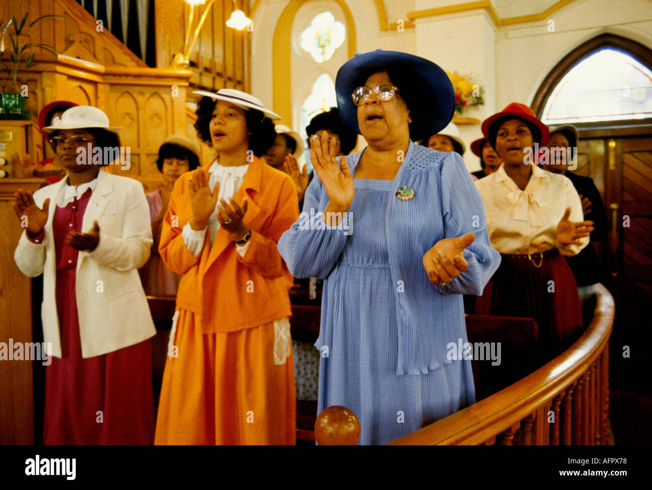 Pentecostal church service in Brixton 1990s UK Hymn singing clapping hands in time to music. Sunday worship south London 90s England HOMER SYKES Stock Photo