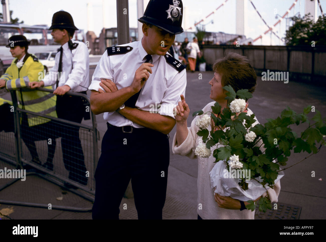 Chelsea Flower Show, police giving directions to visitors. The last day