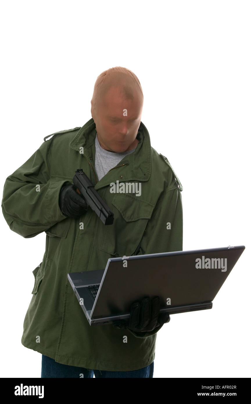 Bank robber aiming a handgun at a laptop Concept of Internet bank robbery Identity fraud Corporate theft etc Isolated on white Stock Photo