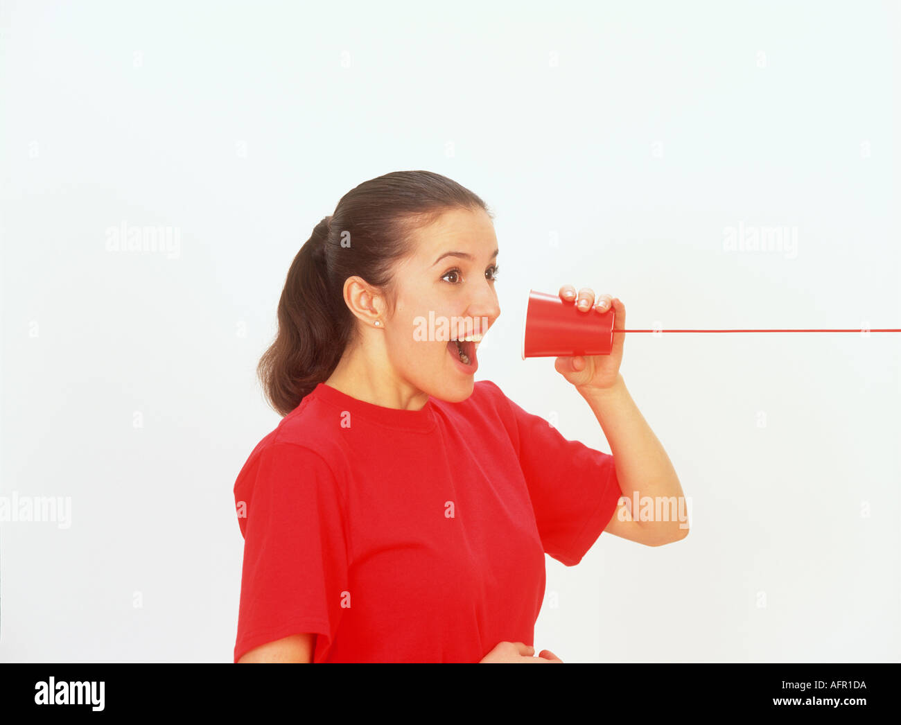 Western Woman Talking on String Telephone Stock Photo - Alamy