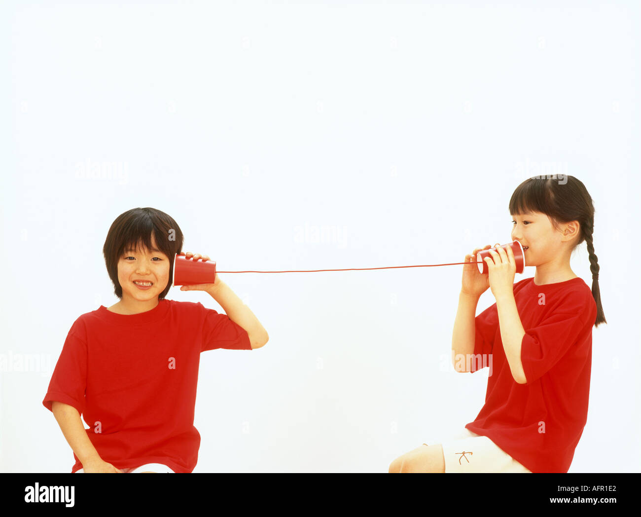 Children on String Telephone Stock Photo Alamy
