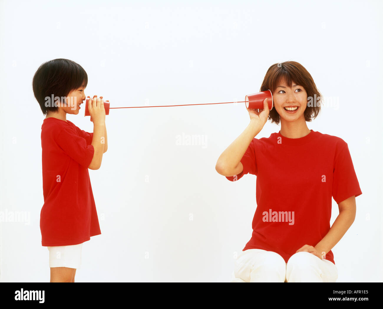 Mother Child on String Telephone Stock Photo Alamy