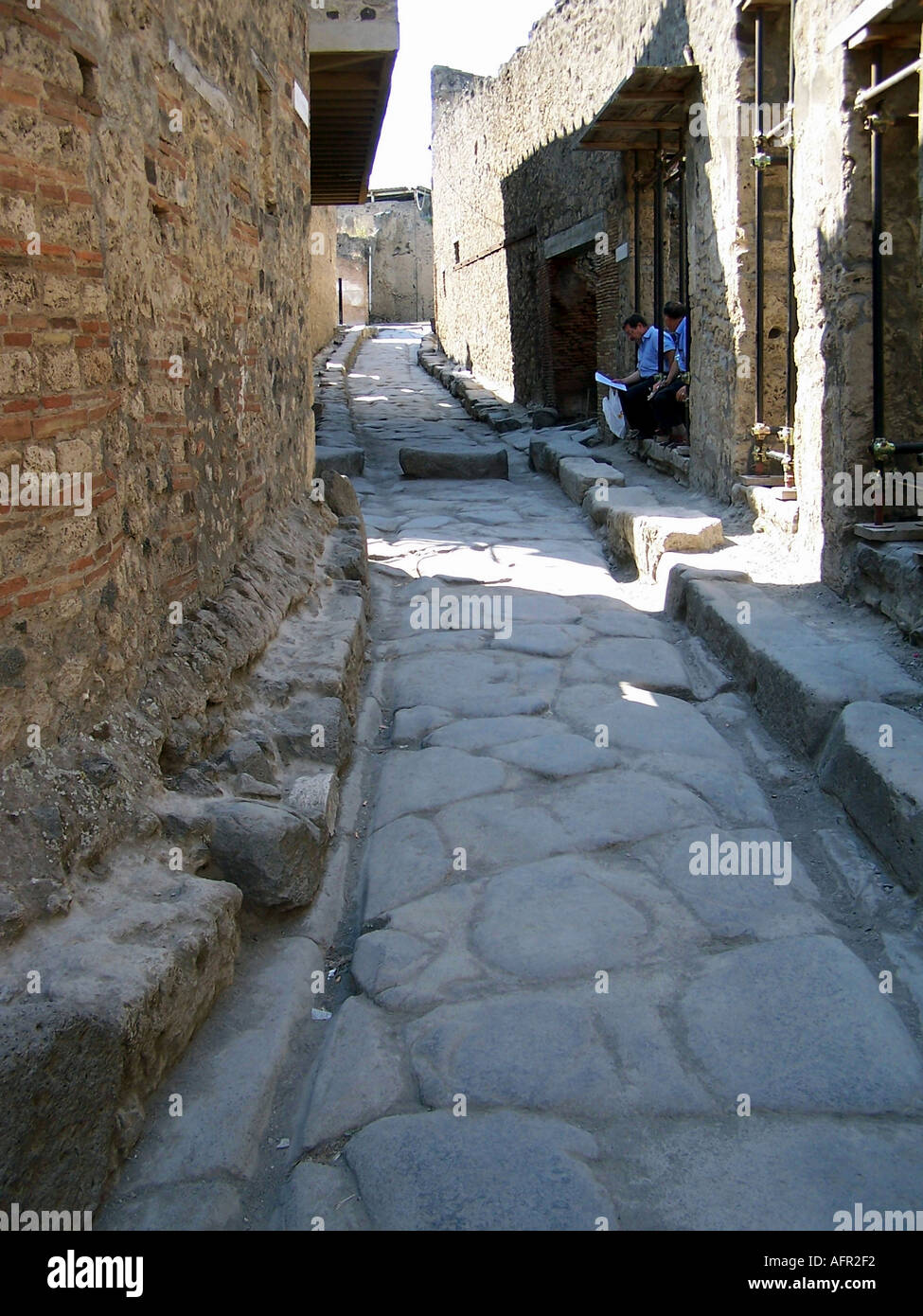 Original cobblestone road in the city of Pompeii Italy Stock Photo - Alamy