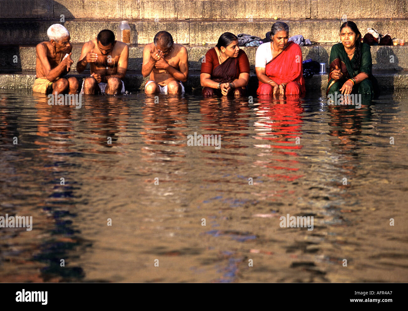 Religious wash washing women hi-res stock photography and images - Alamy