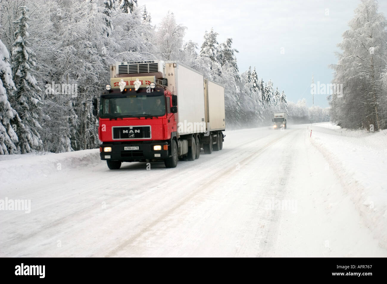 Russian trucks on snowy country road at Winter , Finland Stock Photo