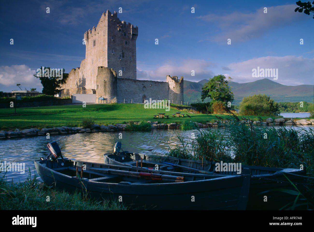 Ross Castle nr Killarney with boats on Lough Leane County Kerry Ireland Stock Photo