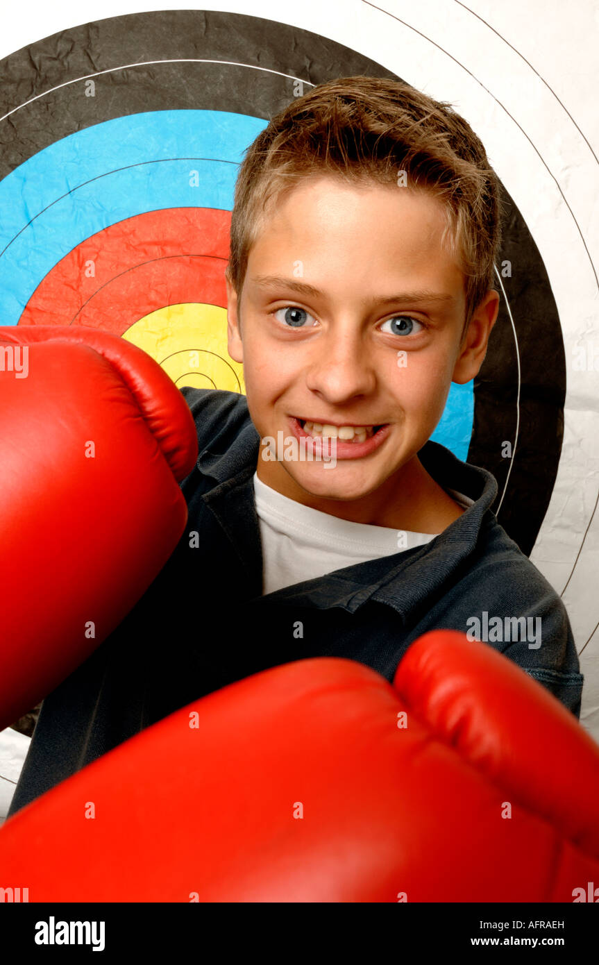 Boy wearing red boxing gloves Stock Photo