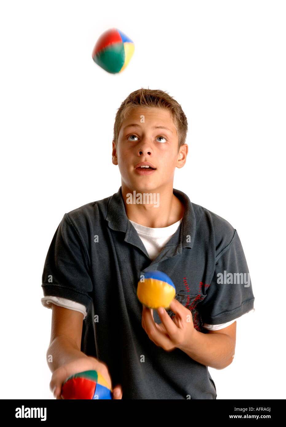 Boy juggling Stock Photo