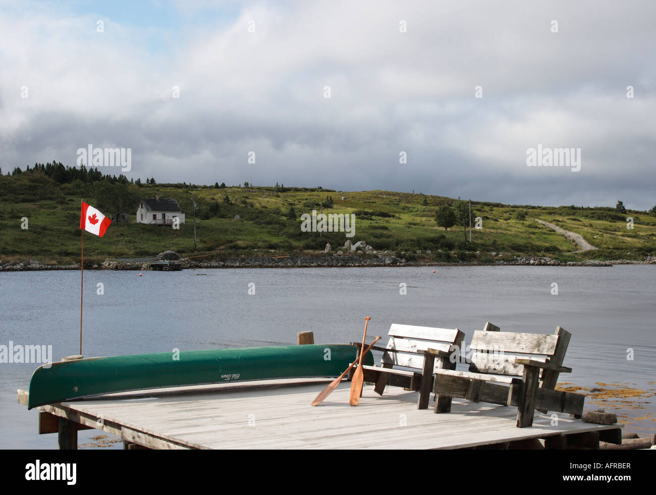 pier with Adirondack bench and upside down Old Town canoe, Nova Scotia