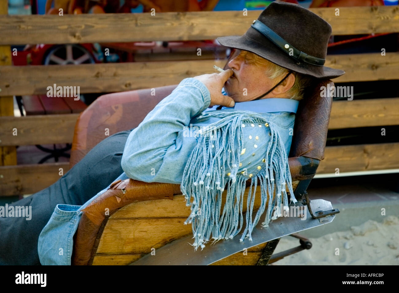 Carriage and Driver on a break smoking cigarette, Jantar seaside resort, Pomerania, Poland, PL, Europe, EU Stock Photo