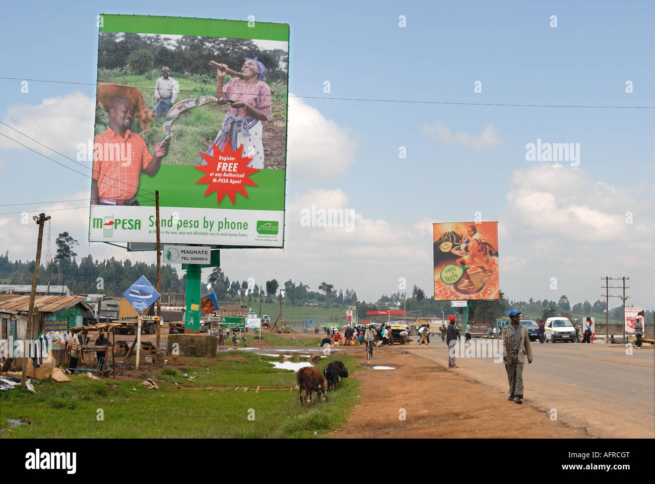 A huge advertising hoarding for Safaricom at the side of the main road at Mau Summit Kenya East Africa Stock Photo