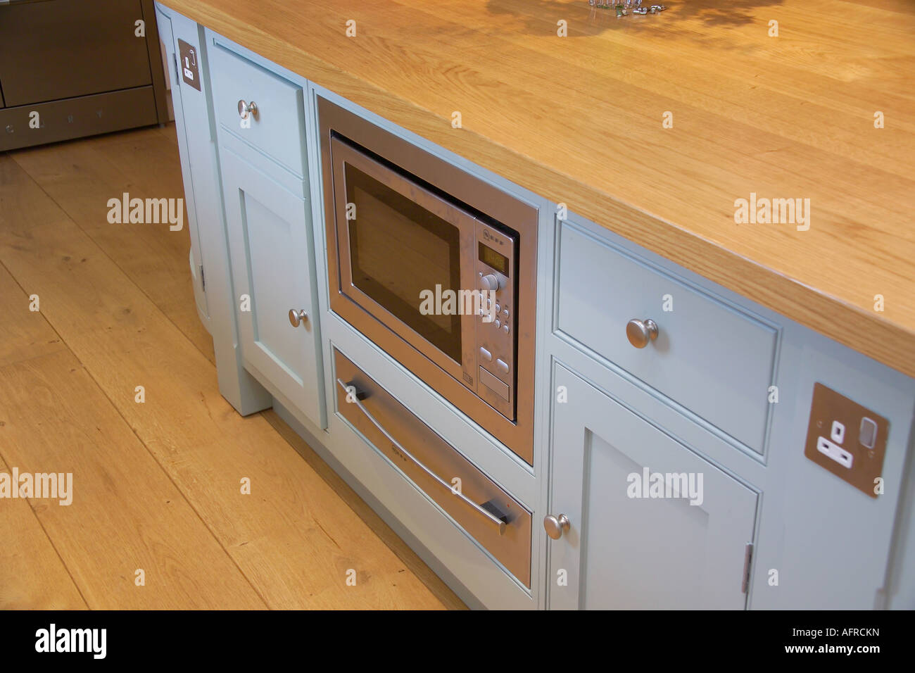 Close Up Of Kitchen Unit With Built In Microwave Oven And Warming