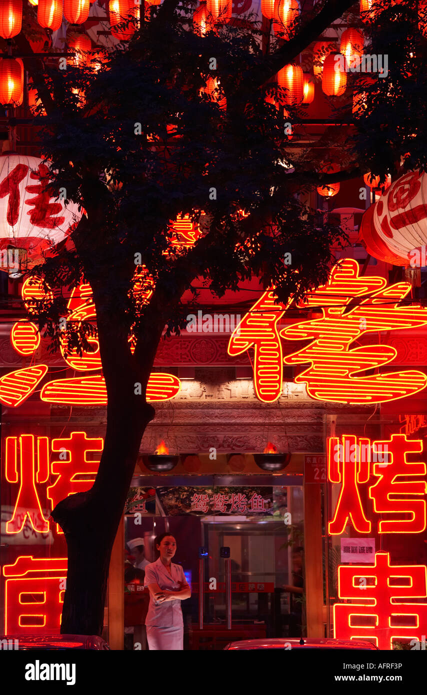 Neon signs, red lanterns around restaurant entrance, Dongzhimen Nei Dajie, Beijing, China. Stock Photo