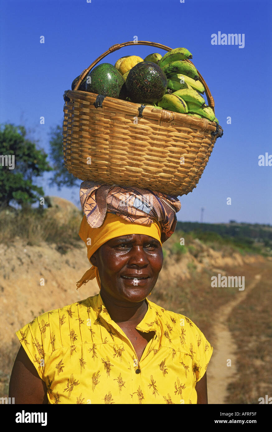 Fruit basket on head hi-res stock photography and images - Alamy