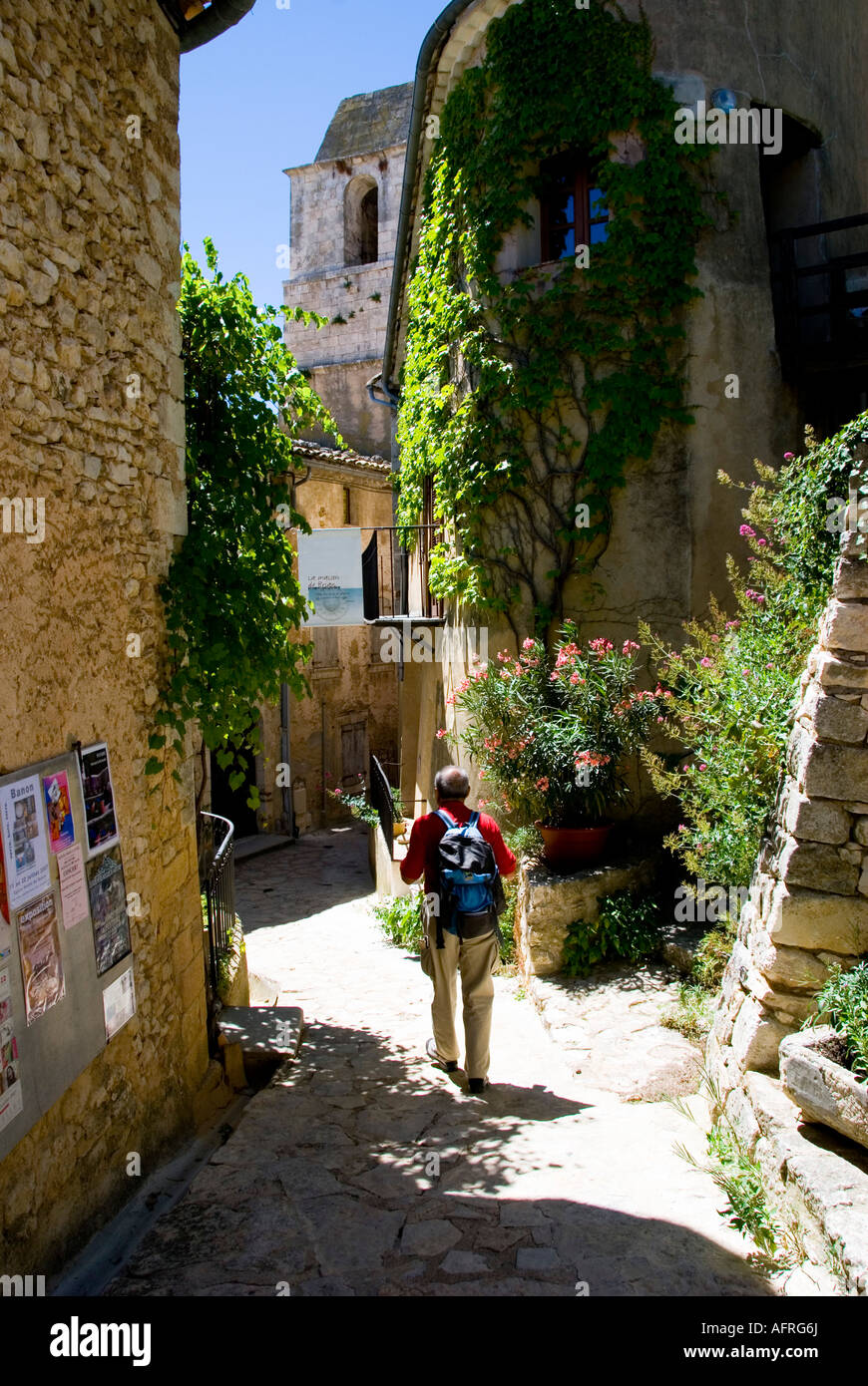 Trekker in Provence village, Southern France Stock Photo