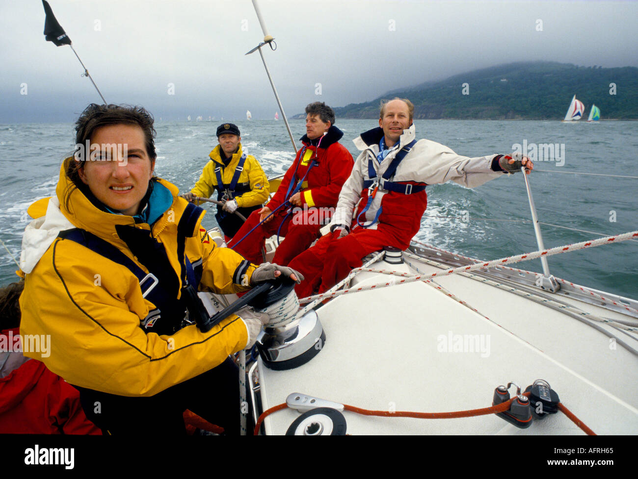 Woman Yacht Racing. Sailing racing yacht. Crew in The Round the Island Race race the Isle of Wight England 1980s HOMER SYKES Stock Photo