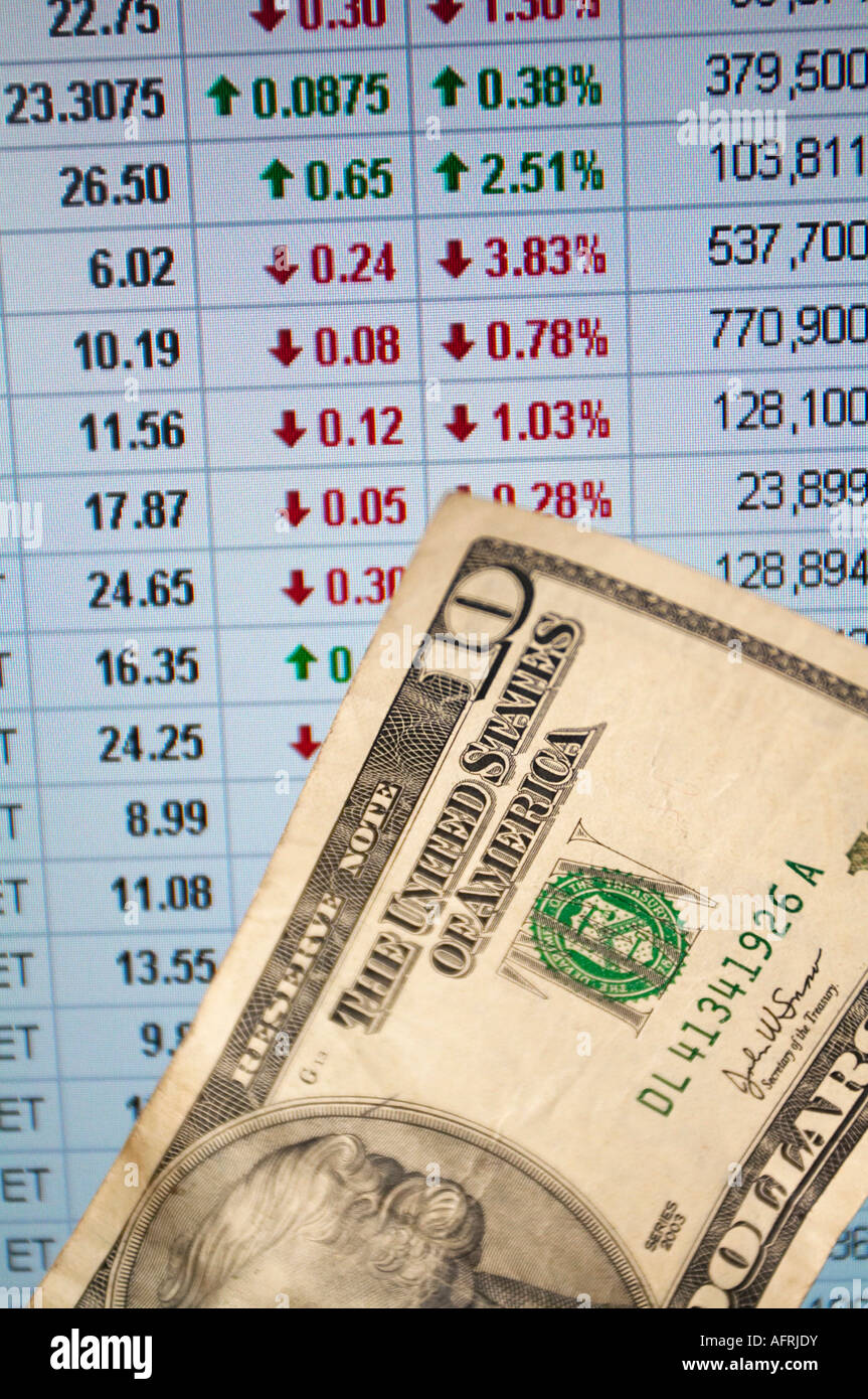A Closeup View Of Online Stock Quotes With A Ten Dollar Bill Stock Photo Alamy
