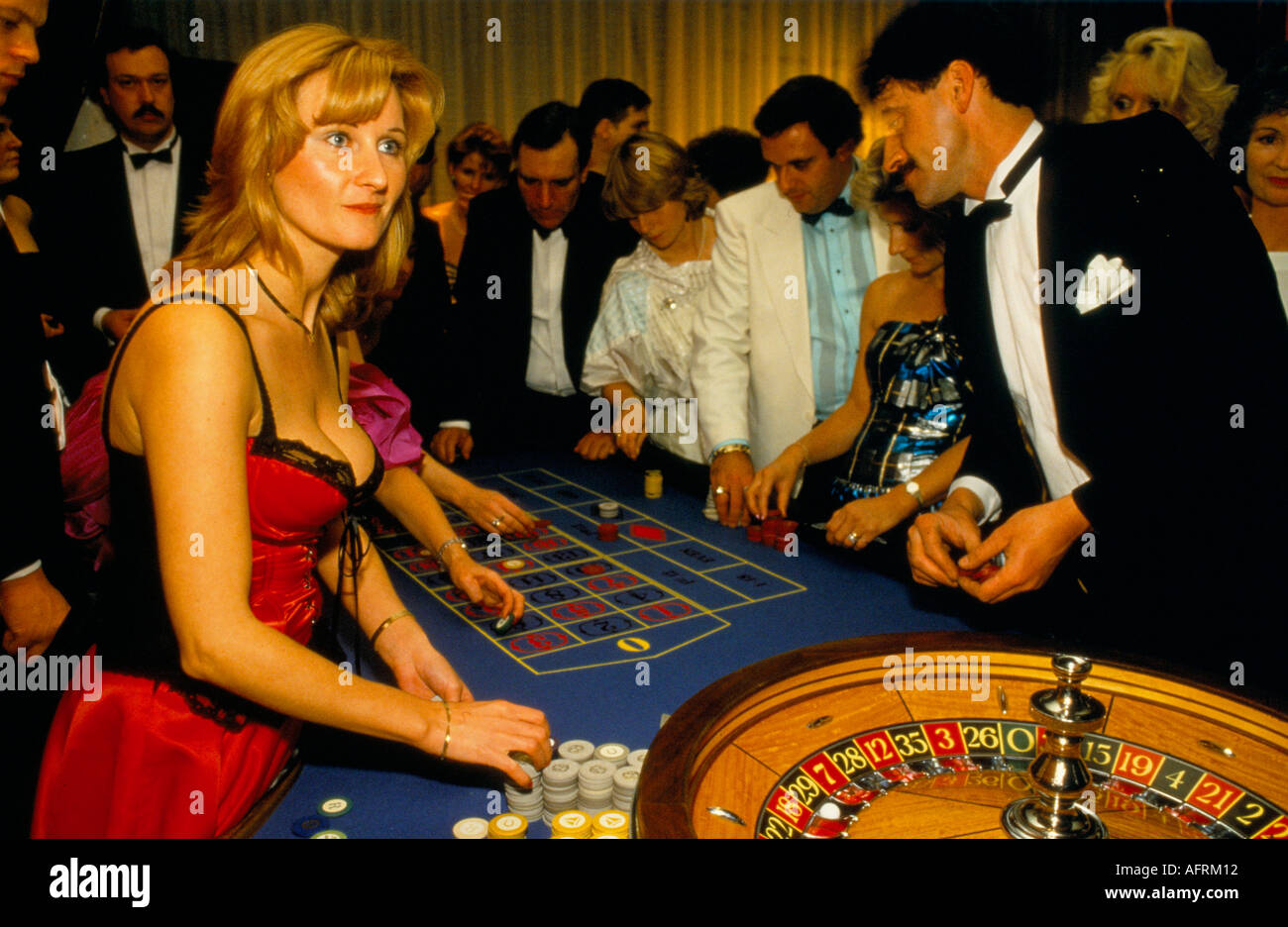 Female croupier UK 1980s. Gambling for charity at casino table ...