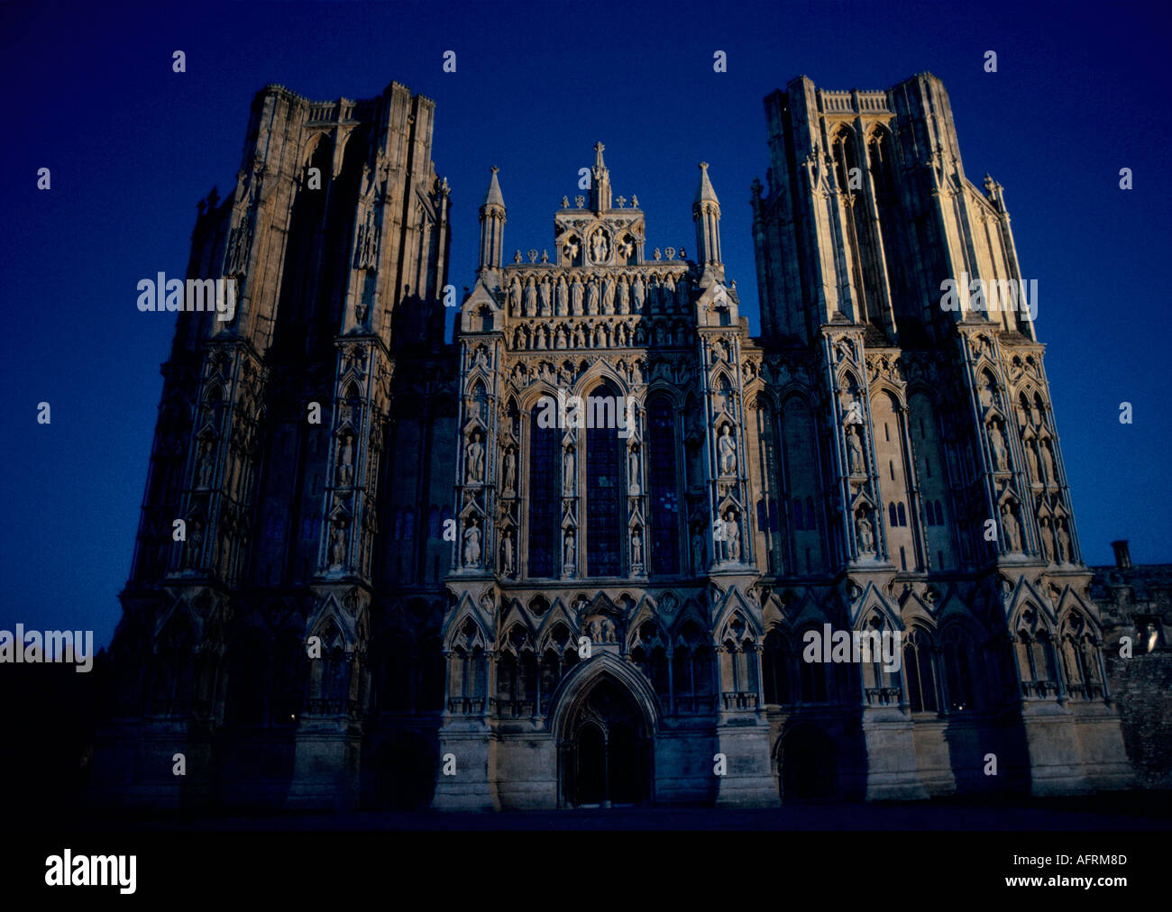 English Cathedrals. The West Facade, the West Front. Wells Cathedral at night Somerset England UK. HOMER SYKES Stock Photo