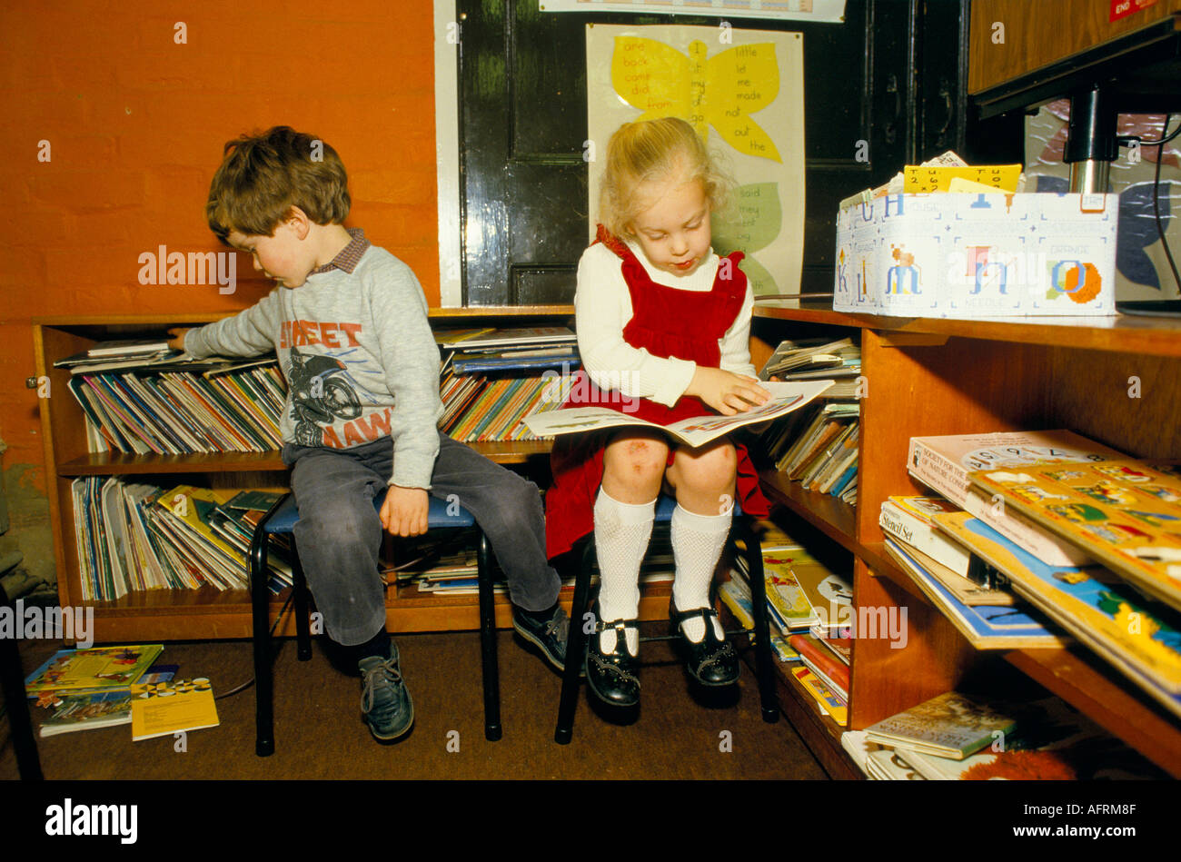Village primary junior school 1980s UK. Children reading by themselves . Sapperton, Gloucestershire. England HOMER SYKES Stock Photo