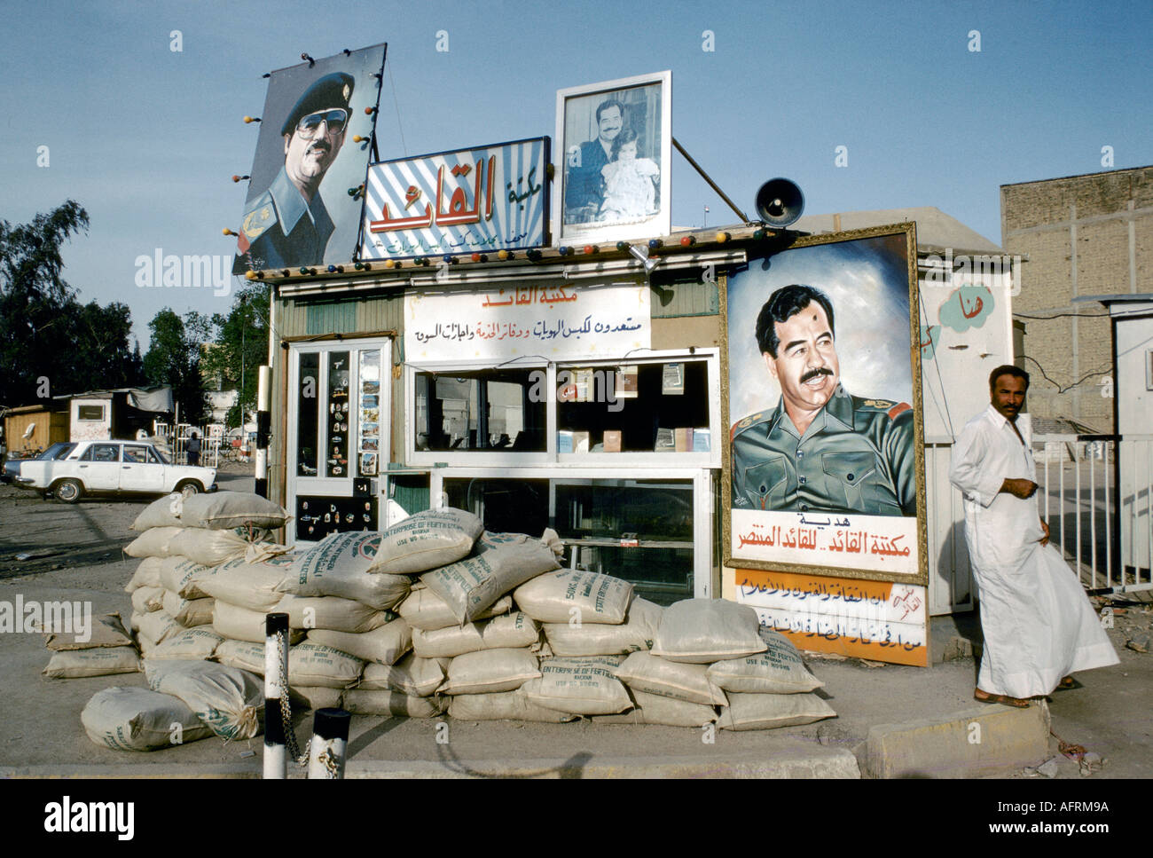 Saddam Hussein bullet holes in posters Basra Southern Iraq 1984. 1980s  HOMER SYKES Stock Photo