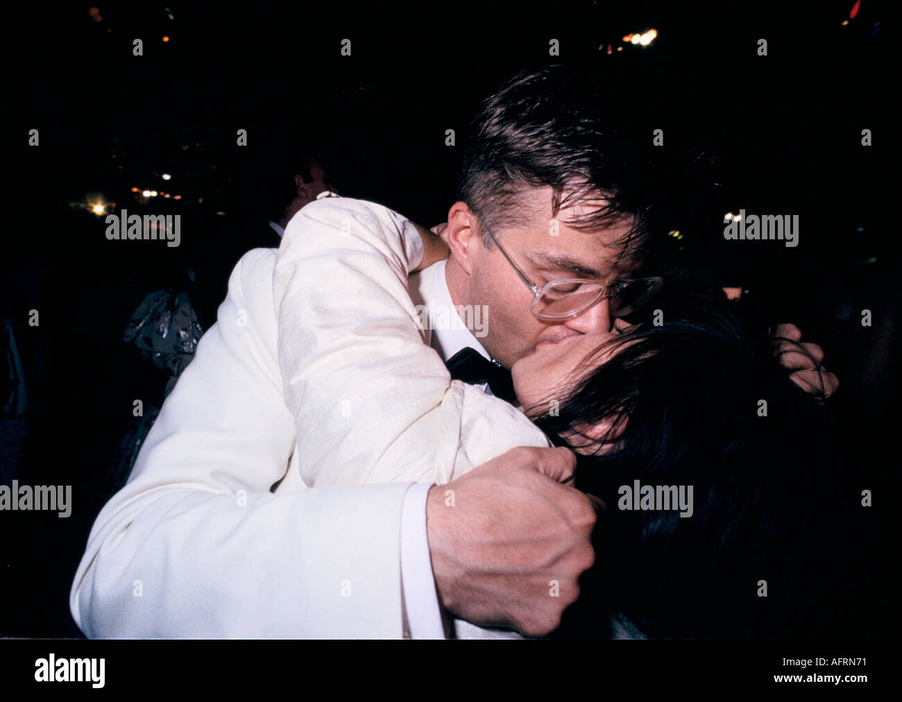 Couple kissing at Cirencester Agricultural College end of year May Ball students embrace 1990s 1995 HOMER SYKES Stock Photo