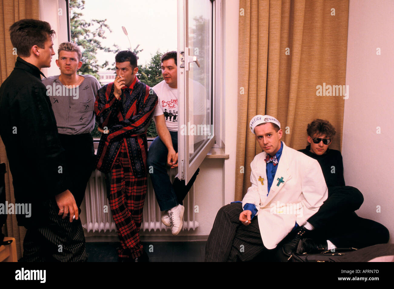 Frankie Goes to Hollywood (2nd left photographer Anton) and 4th left manager Tony. 'Holly Johnson'  in white 1983 1980S HOMER SYKES Stock Photo
