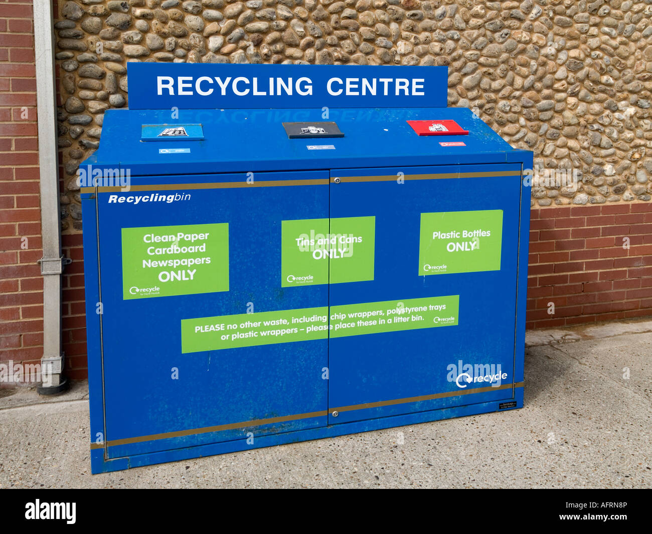 A neat blue recycling bin for paper tins and plastic bottles North