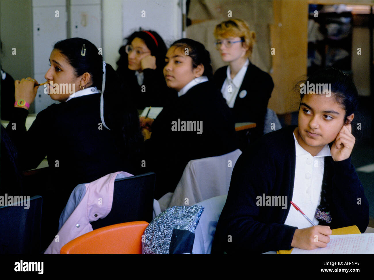 Secondary School 1990s UK. Mixed race group ethnic diversity girl students classroom Greenford High School, Middlesex  London 1990 England HOMER SYKES Stock Photo