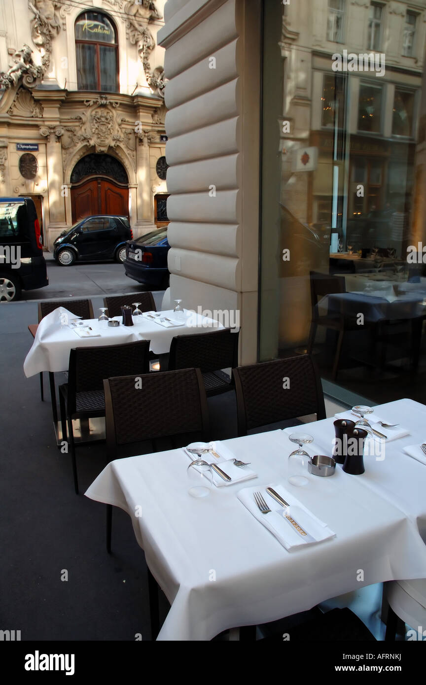 Table set for al fresco summer dining outside restaurant in the central district of Vienna Austria Stock Photo