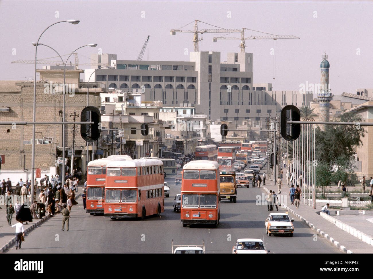 Busy street scene Baghdad Iraq.British Leyland buses.1984 PHOTO Stock