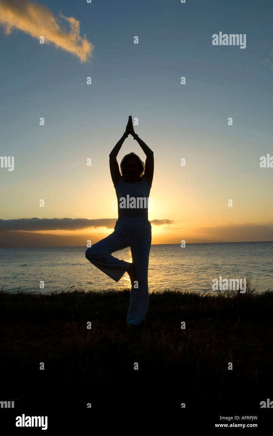 woman in a classic yoga pose at the beach Stock Photo - Alamy woman in a classic yoga pose at the beach Stock Photo - Alamy