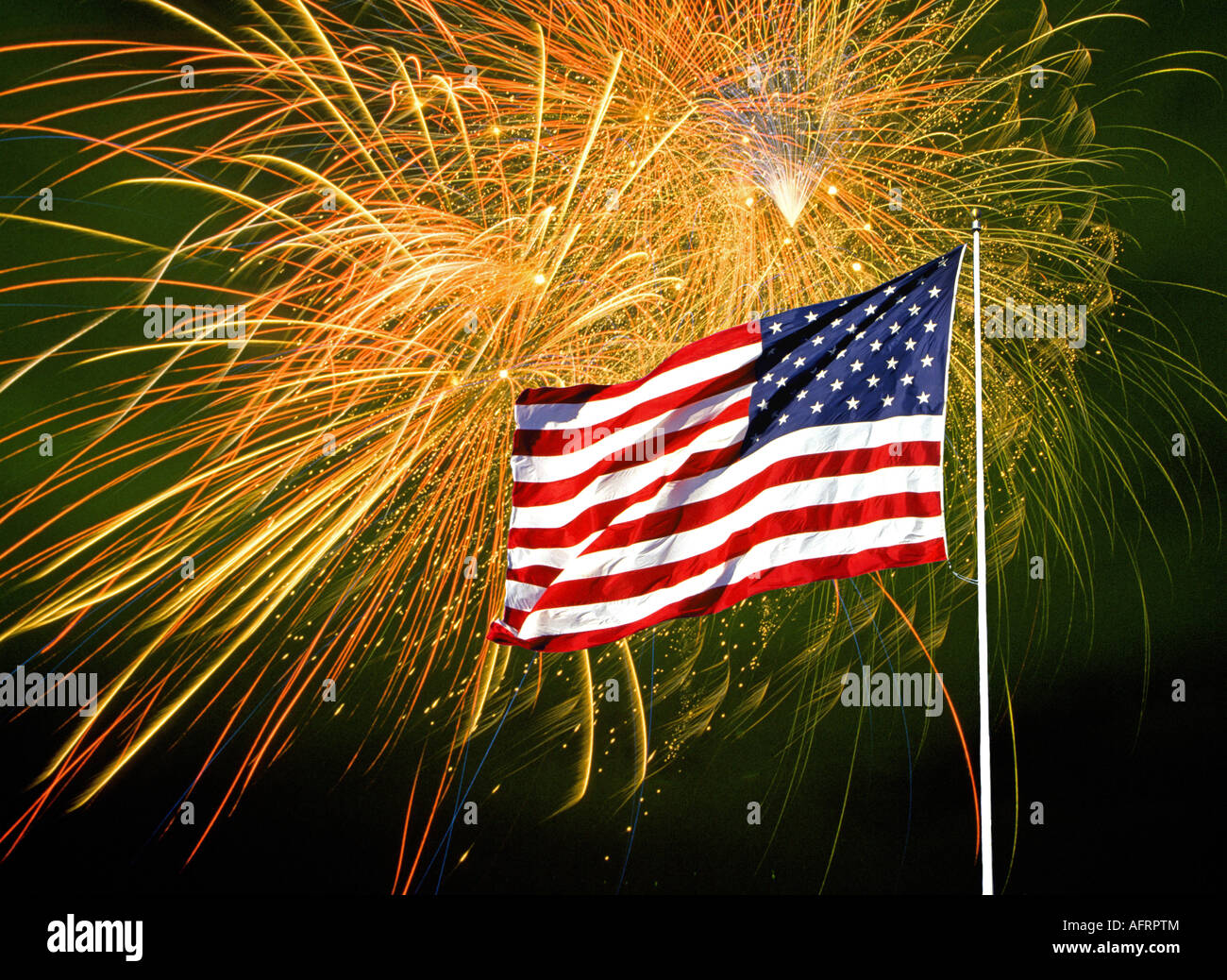 An American flag in front of a fireworks display on July the 4th the