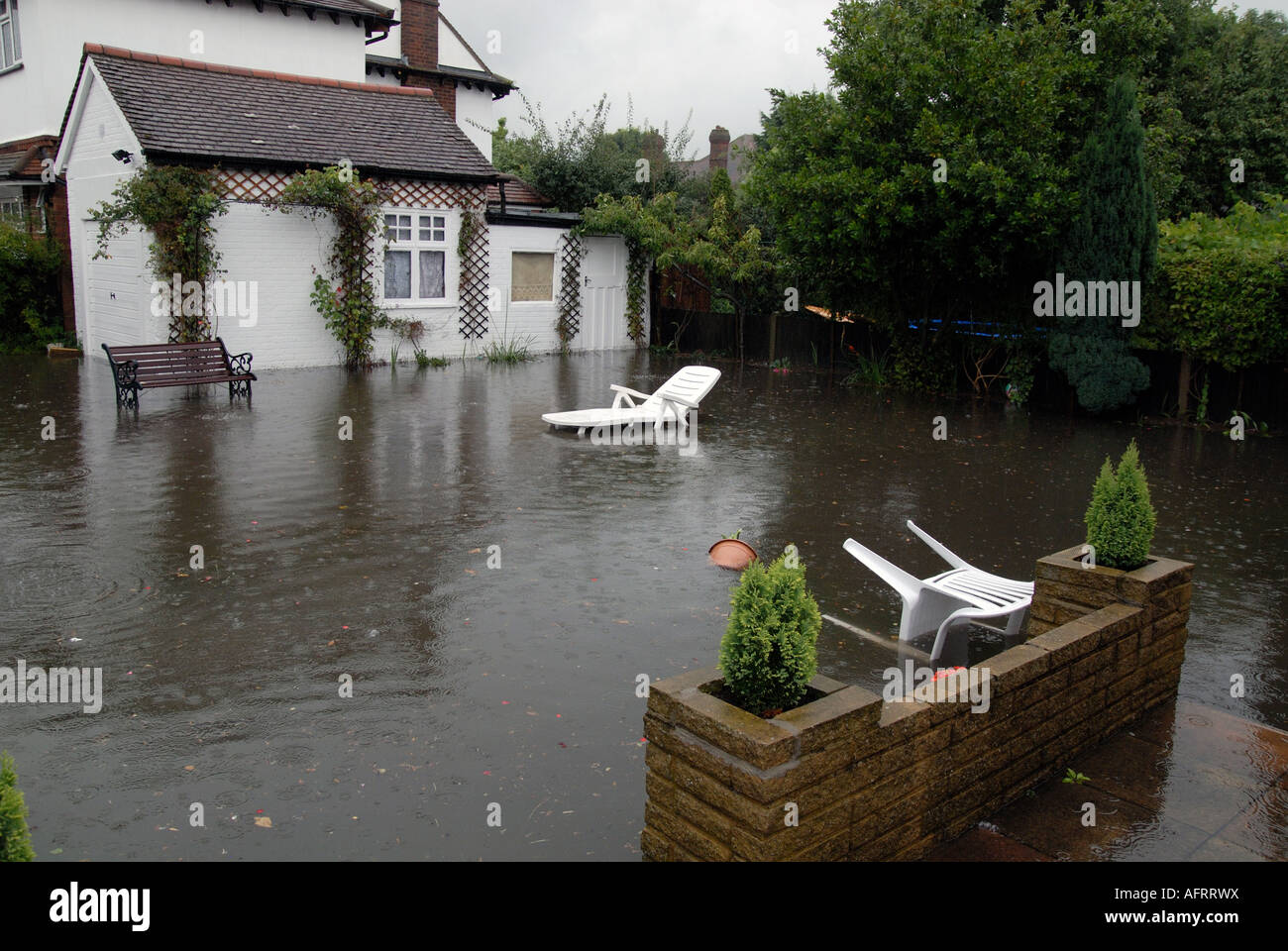 A flooded garden Stock Photo Alamy