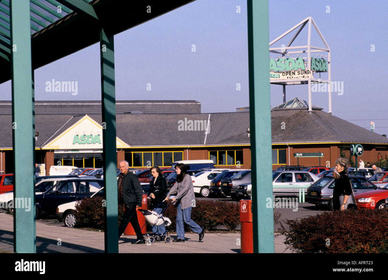 Asda out of town supermarket shopping centre people going shopping
