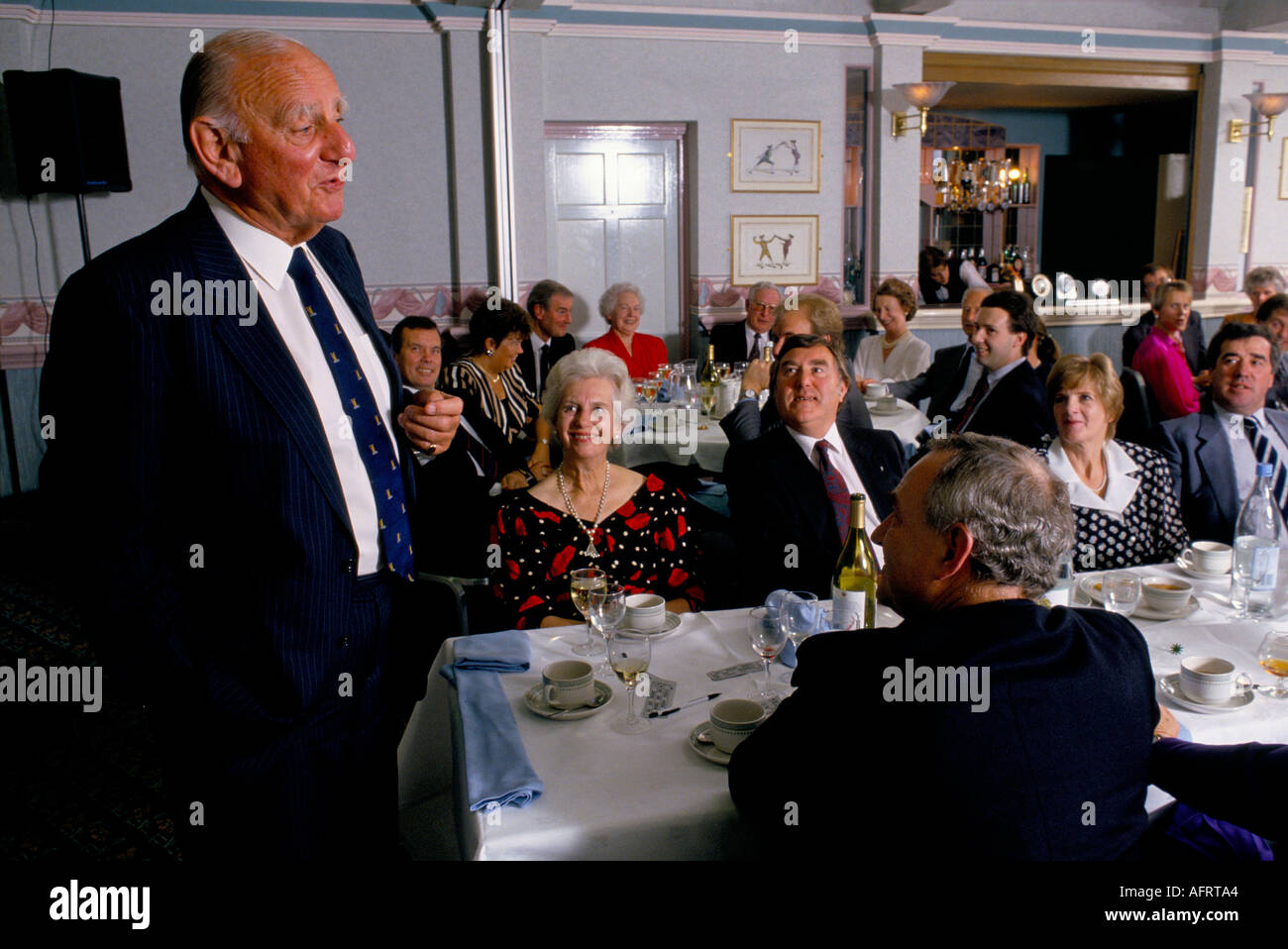 Brian Johnston After Dinner Speaker, cricketer speaking engagement audience of business people. 1990s UK 1992 George Hotel Gloucester Gloucestershire Stock Photo