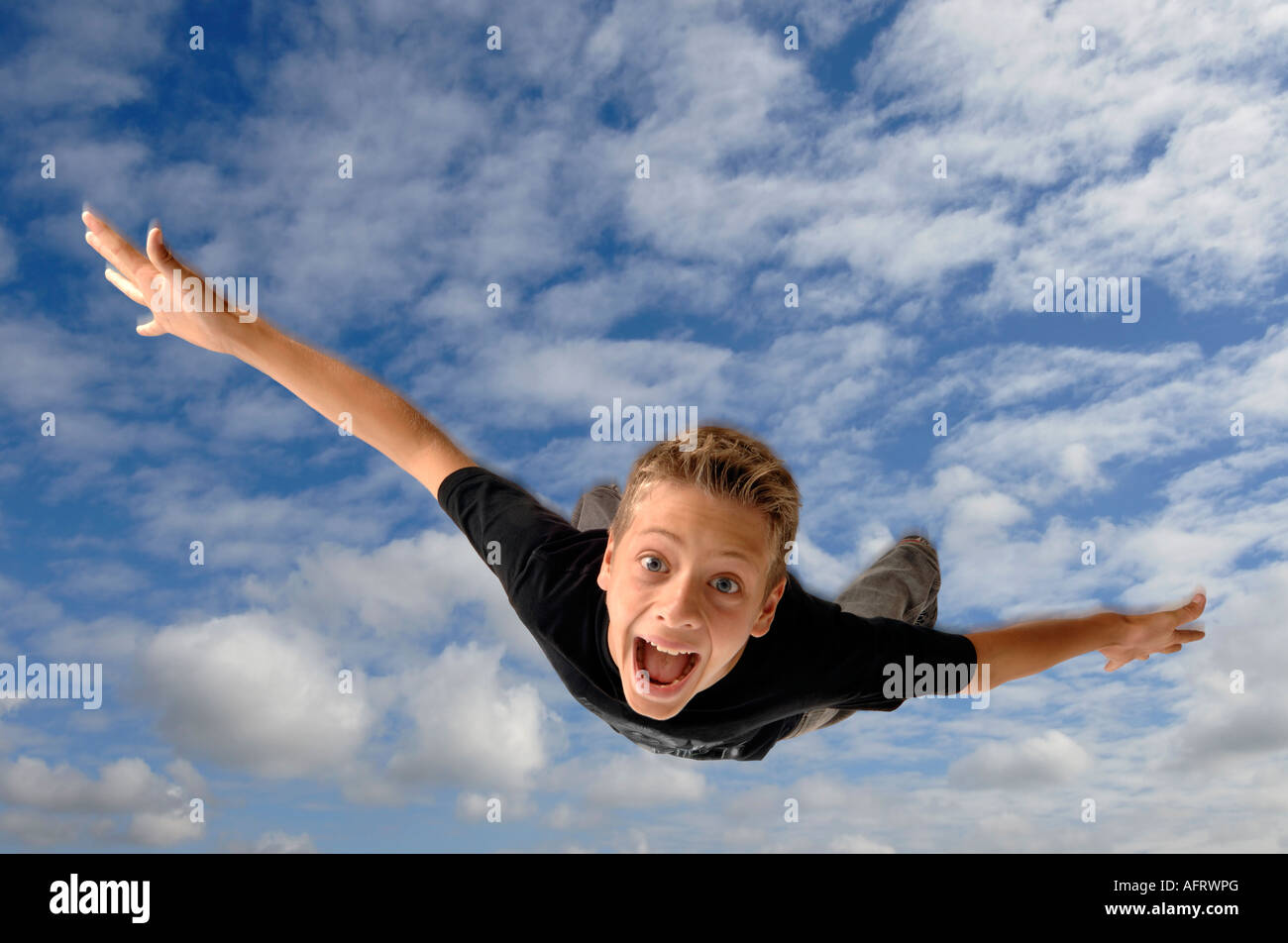 Boy falling to earth Stock Photo