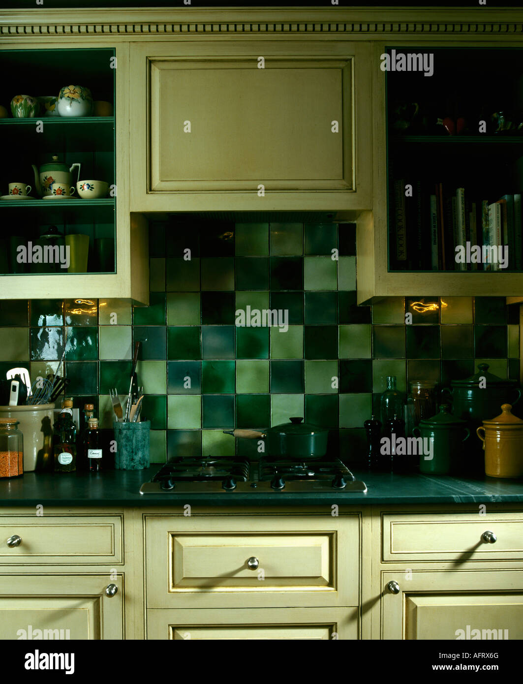 Pale And Dark Green Tiles Above Kitchen Hob Stock Photo Alamy