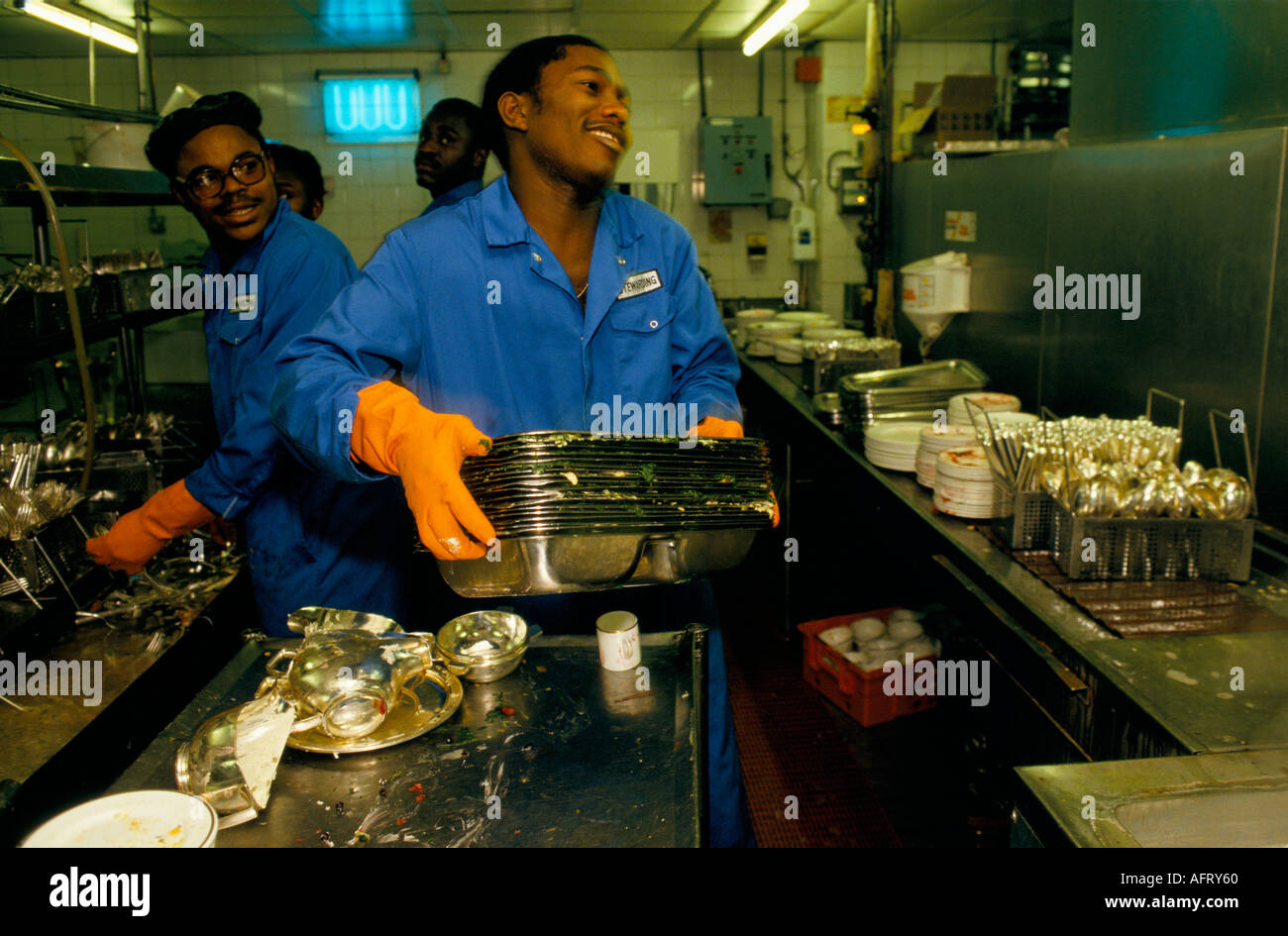 Low paid immigrant group of men working part time in the kitchens of an international London Hilton Hotel circa 1995 1990s HOMER SYKES Stock Photo